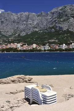 Deckchairs on a beach Stock Photos