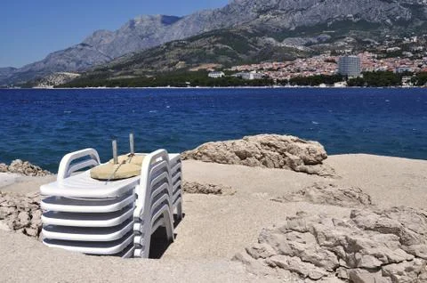 Deckchairs on a beach Stock Photos