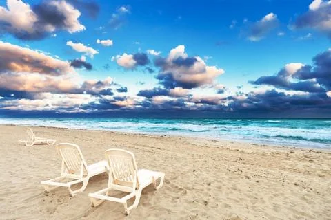 Deckchairs on a beach Foto stock
