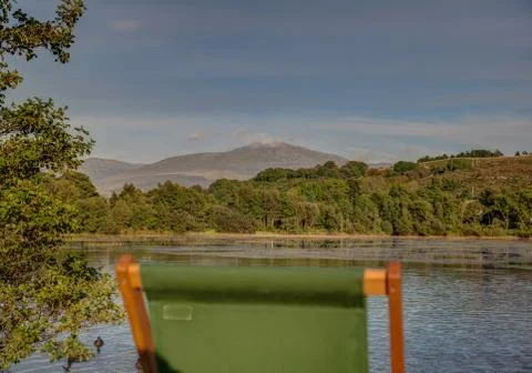 Deckchairs at sunset Stock Photos