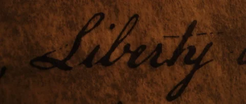 Declaration of Independence Liberty is highlighted by flickering candle light Stock Footage 224767852