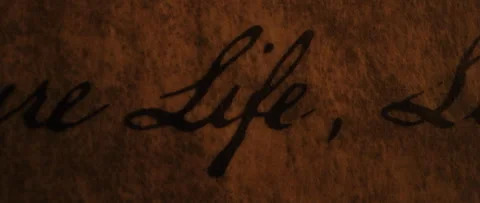 Declaration of Independence Life  is highlighted by flickering candle light Stock Footage 224766694