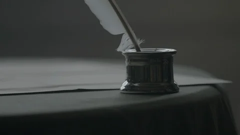 Declaration of Independence - Man takes quill from ink well to sign 库存影片 95951787
