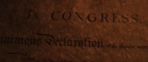 Declaration of Independence panning across title by flickering candle light Stock Footage 148875590