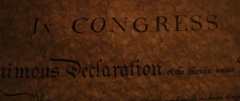Declaration of Independence panning across title by flickering candle light Stock Footage 224945626