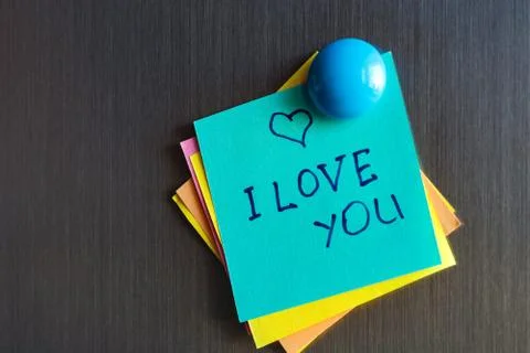 Declaration of love on the sticker for notes on the refrigerator. Stock Photos