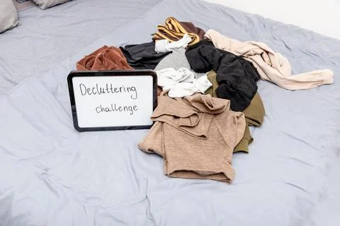 Decluttering challenges text on board on cloth background, trend clearing spa 스톡 사진