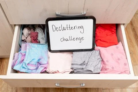 Decluttering challenges text on board on cloth background, trend clearing spa Photos
