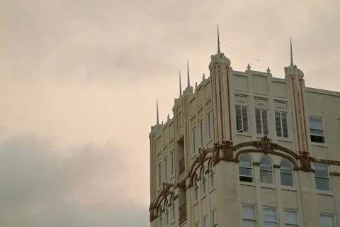 Deco building cloudy sky Stock Photos