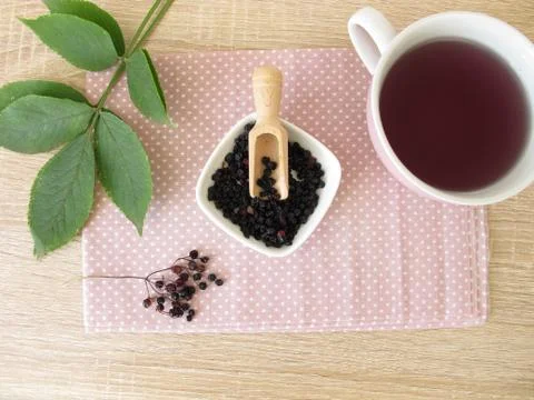 Decoction, boiled tea from dried elder berries Stock Photos