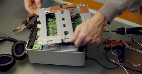 Deconstructing damaged musical player Stock Footage 128319659