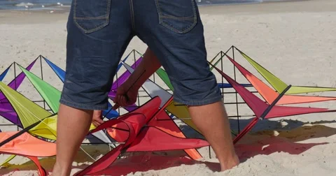 Deconstructing a Kite - People Are Deconstructing their kites on the Stock Footage 54210155