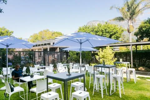 Decor and set-up in garden seating area at conference venue Stock Photos