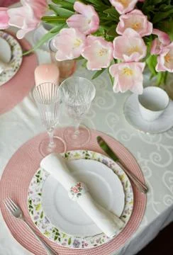 Decor and spring table setting is a vase with pink tulips Stock Photos