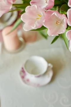 Decor and spring table setting is a vase with pink tulips Stock Photos