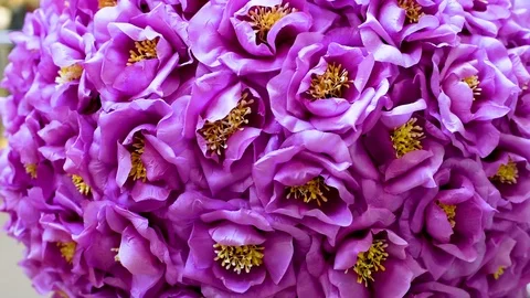 Decor of artificial flowers in the shape of a ball in artificial lightDecor of a Stock Footage 105987380