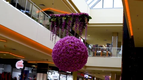 Decor of artificial flowers in the shape of a ball in artificial lightDecor of a Stock Footage 106054748