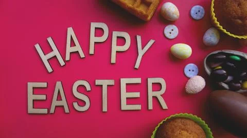 Decor Easter eggs on pink background. Flat lay, top view. Easter concept. Stock Photos