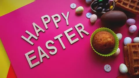 Decor Easter eggs on pink background. Flat lay, top view. Easter concept. Stock Photos