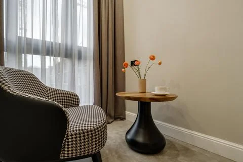 Decor elements of the guest room and rest room with a tea table, an armchair  Stockfoto's