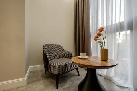 Decor elements of the guest room and rest room with a tea table, an armchair  Stockfoto's