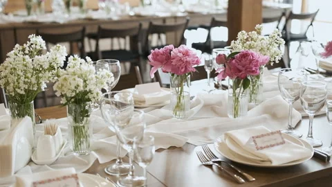 Decor of flowers on the table in pink and white tones. Decorations on the table Stock Footage 196877425