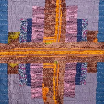 Decor of handcrafted crinkled silk patchwork scarf Stock Photos