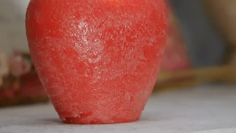 The decor. Panorama of a burning candle in the form of an apple. 스톡 동영상 105671387