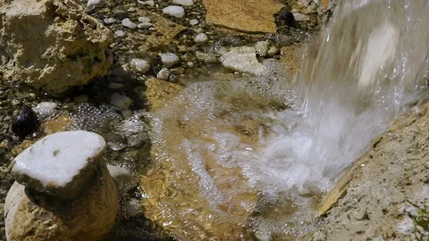 The decor in the Park. A small waterfall flows from a large jug. Large view Video stock 92156473