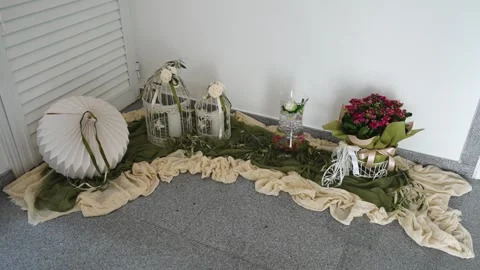 Decor setup with plants and decorations in a simple indoor space Stock Footage 334995009