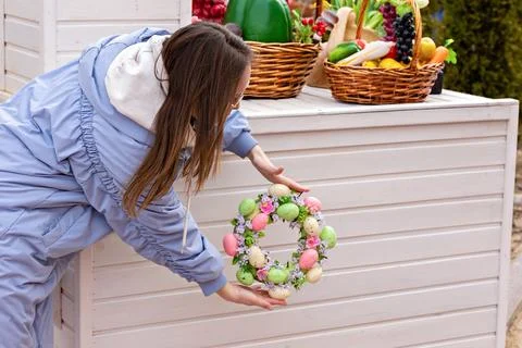 The decor of the street for Easter. A bright Easter egg wreath in the decorat Stock Photos