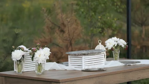Decor on the table with white flowers. Holiday decorations Stock Footage 196878075