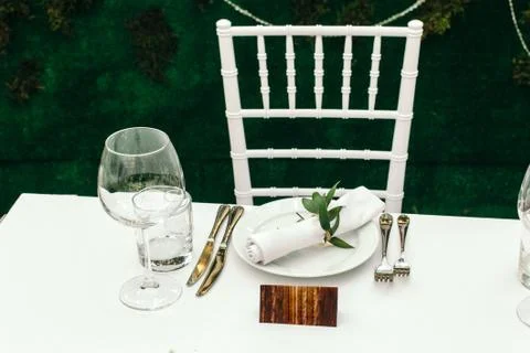 The decor at the wedding. Table for guests on the veranda, in the background of Stock Photos