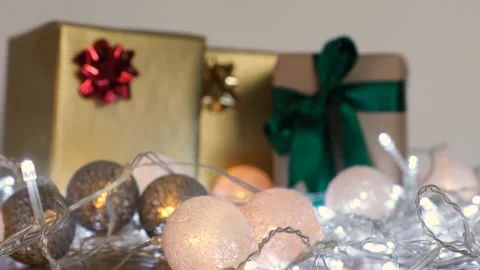 Decorate the table with gift boxes and led lights. Vídeo Stock 142057403