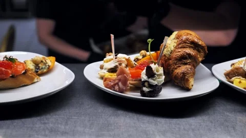 Decorated banquet table with appetizers canapes. buffet for the holiday Stock Footage 336664576