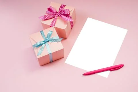 Decorated boxes and blank white sheet of paper. Stock Photos