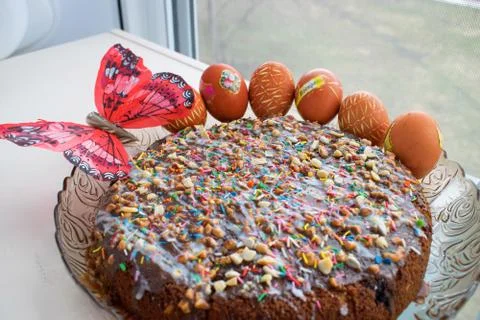 Decorated cake for Easter with peanuts and boiled eggs Tag Is risen Stock Photos