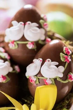 Decorated Chocolate easter egg on wooden table Stock Photos