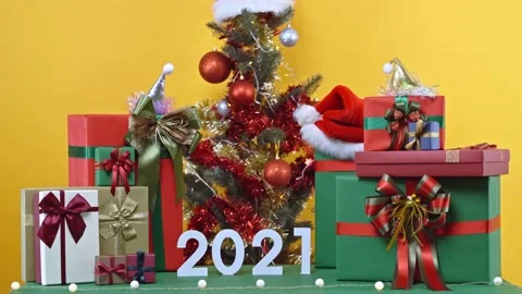 Decorated christmas tree and present gift box. Merry christmas and happy new yea Stock Footage 145132579