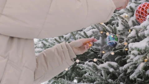 Decorated Christmas tree and snowfall Stock Footage 166388232