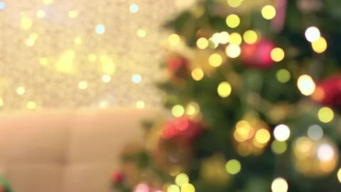 Decorated Christmas tree background defocused gold red garland blurred flashing Stock Footage 221044977