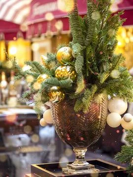 Decorated Christmas tree on the background of soft yellow lights with bokeh.. Stock Photos