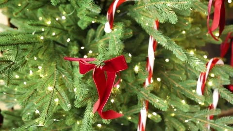 Decorated Christmas tree with candy canes, red ribbons Stock Footage 320879392