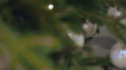 Decorated Christmas tree close-up. Shiny balls and garland with lights with Stock-Footage 119921755