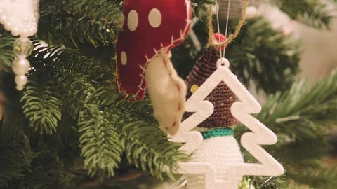 Decorated Christmas tree closeup. Red and golden balls and illuminated garland Stock Footage 99242462