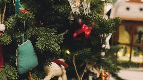Decorated Christmas tree closeup. Red and golden balls and illuminated garland Stock Footage 99242978