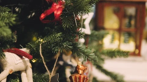 Decorated Christmas tree closeup. Red and golden balls and illuminated garland Stock-Footage 99243386
