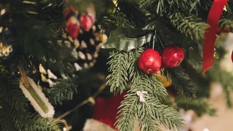 Decorated Christmas tree closeup. Red and golden balls and illuminated garland 動画素材 99243535