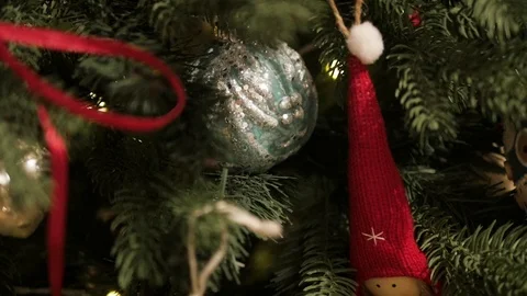 Decorated Christmas tree closeup. Red and golden balls and illuminated garland Stock-Footage 99243726