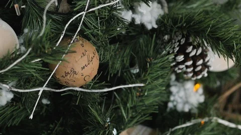Decorated Christmas tree closeup. Red and golden balls and illuminated garland 库存影片 99330620